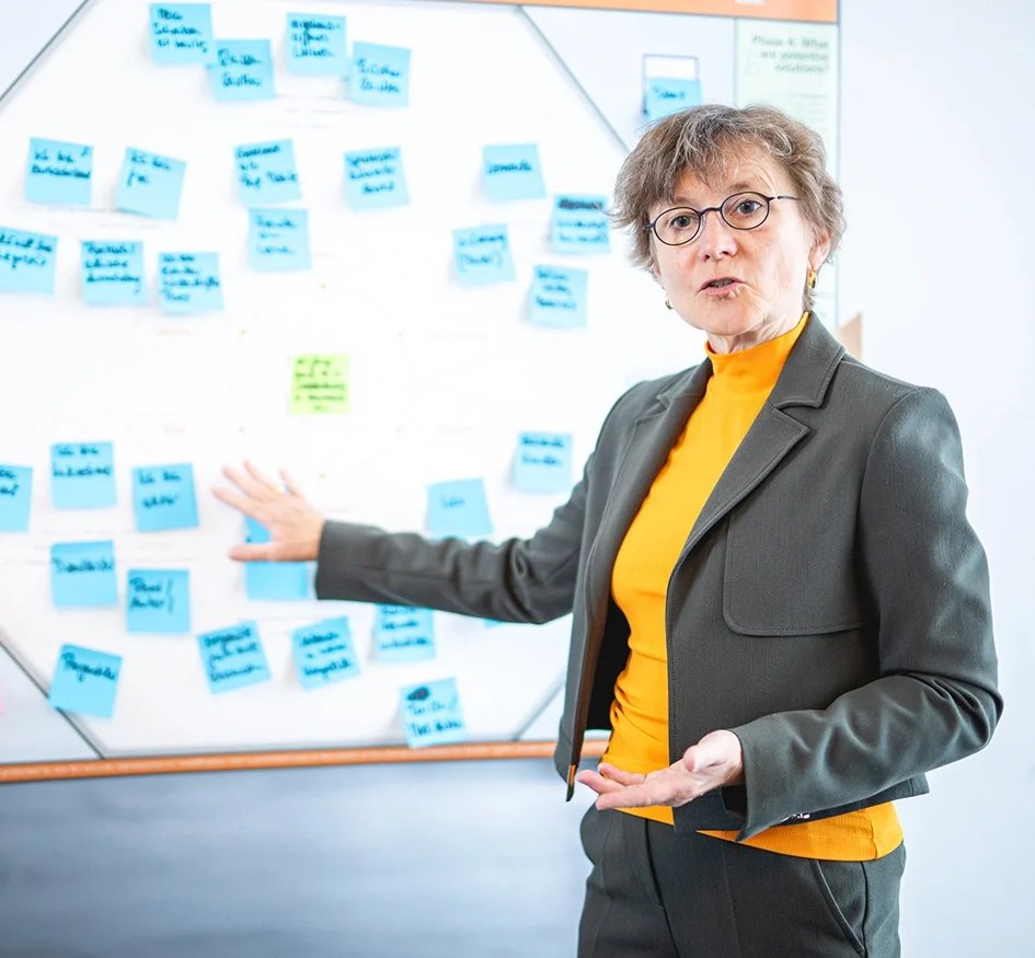 Trainer explaining strategy during workshop session