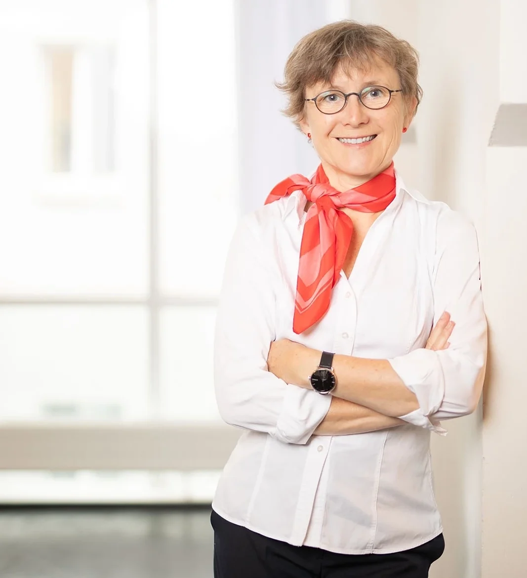 Professional portrait of Petra Nieckchen in bright office