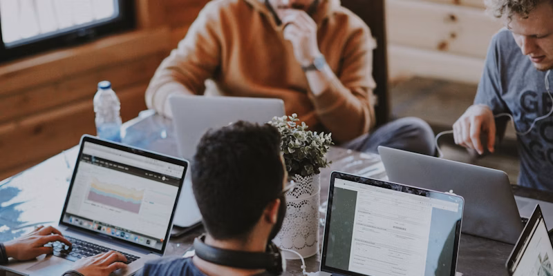 Person working on laptop during online meeting